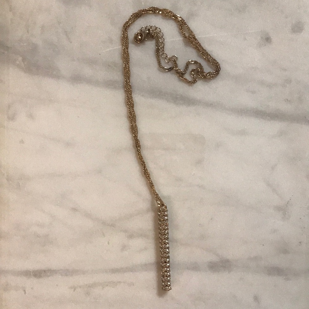 Long gold necklace with diamond pendant